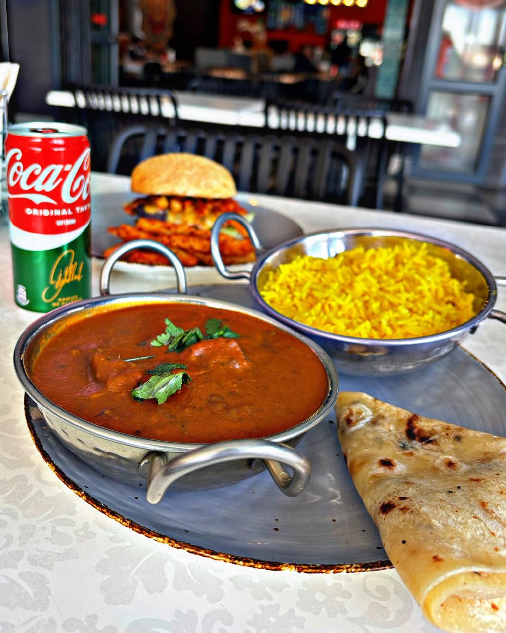 Full platter with curry, rice, and roti